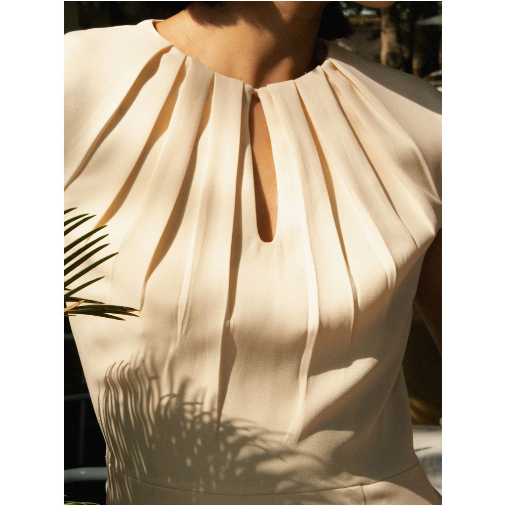 A stylish pencil skirt with pleats a fitted waist to flatter the figure and pockets suitable for both work and business occasions image 1
