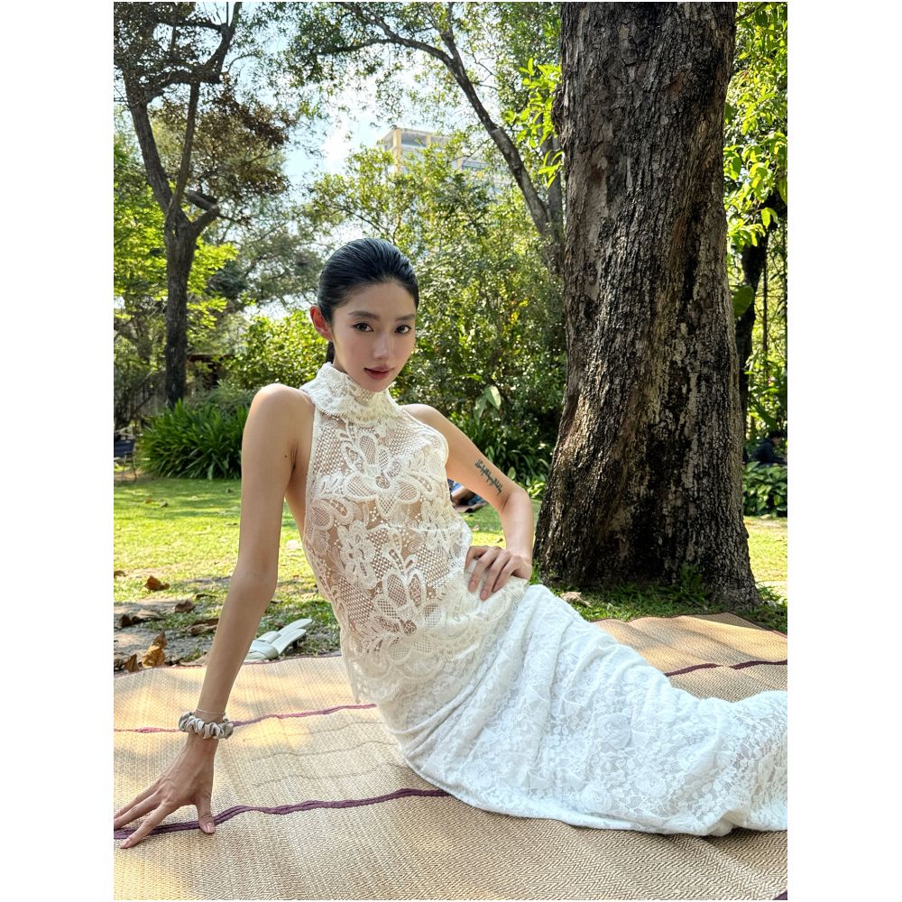 Rosie a beautiful young woman wears a see through alluring high necked backless lace trimmed top vest image 0