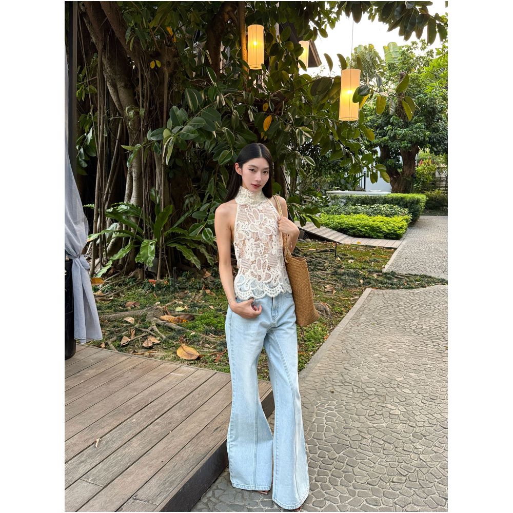Rosie a beautiful young woman wears a see through alluring high necked backless lace trimmed top vest image 1