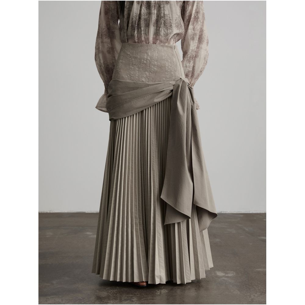 INDULGE Gong Shan A line midi skirt with a unique deconstructed design featuring an irregular wide waistband pleated details and tie up cinches image 1