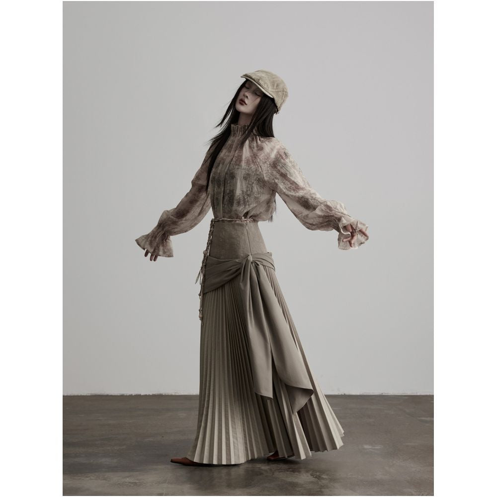 INDULGE Gong Shan A line midi skirt with a unique deconstructed design featuring an irregular wide waistband pleated details and tie up cinches image 2