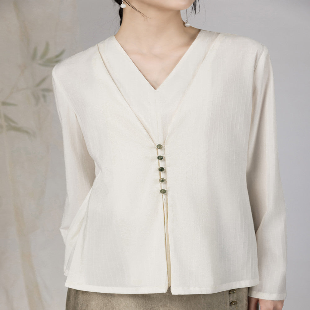 Yyan means new Chinese style white fake two piece shirt with V neck and autumn jade pearl buckle design long sleeved top for women image 0