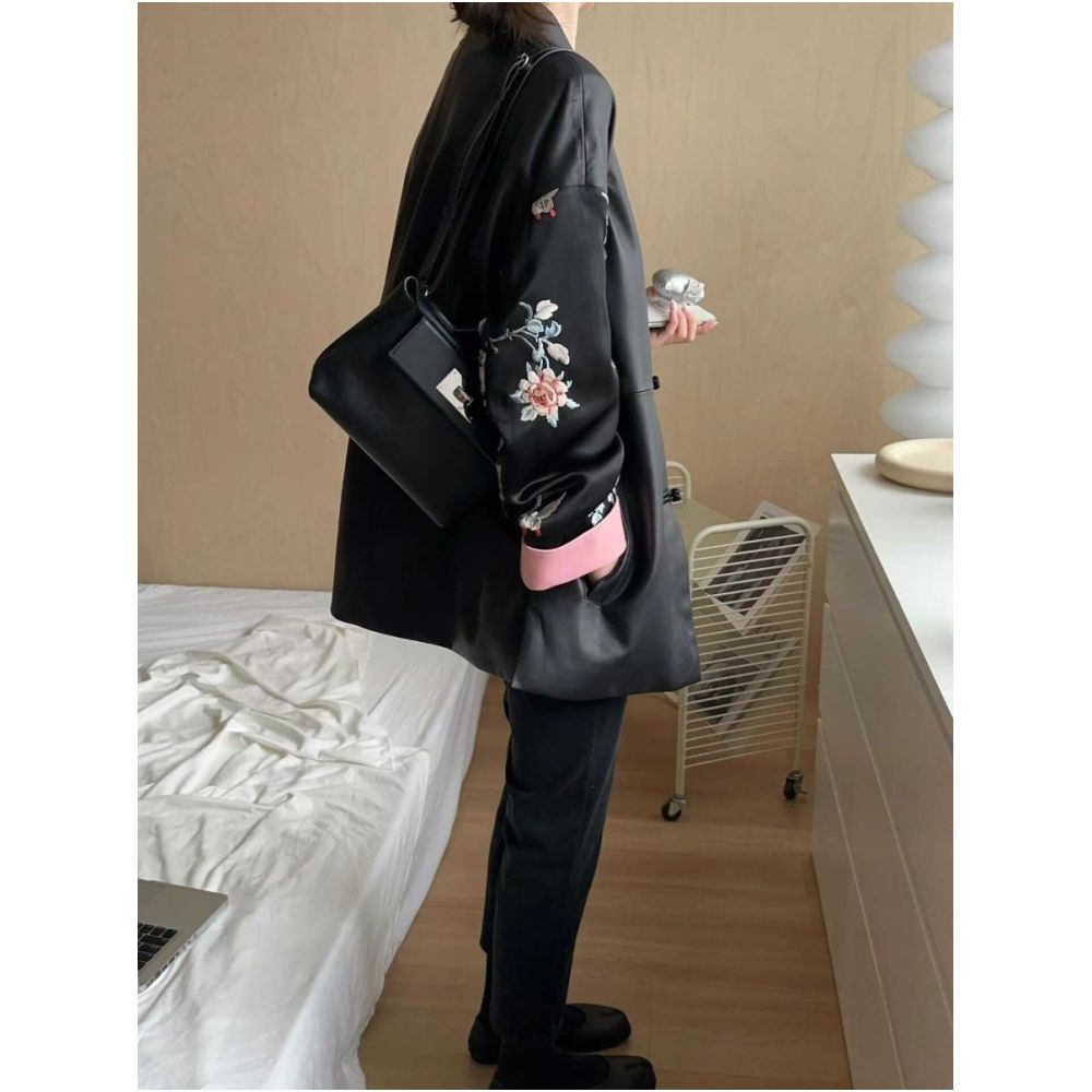 2025 early autumn outfit new stand up collar black same style Chinese knot national style Western style loose leather jacket women s mid length jacket image 1